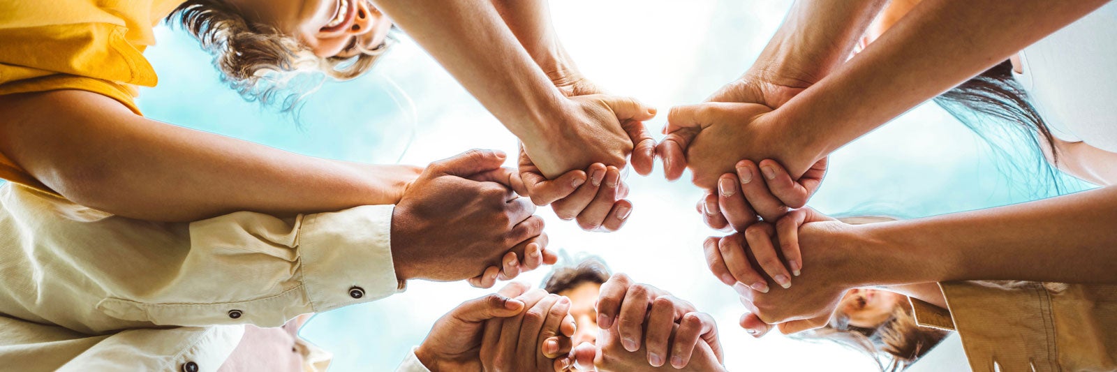 community holding hands